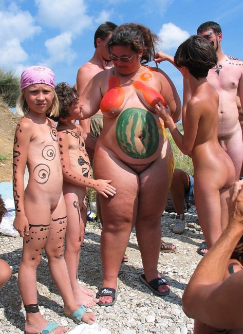 Nudists on a beach organized bodyart [Nudism-Planet]