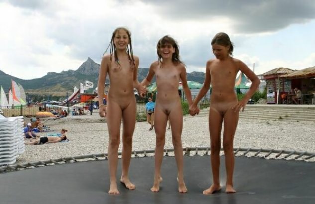 Girls nudists on a beach spring bare on a trampoline [Nudism-Planet]